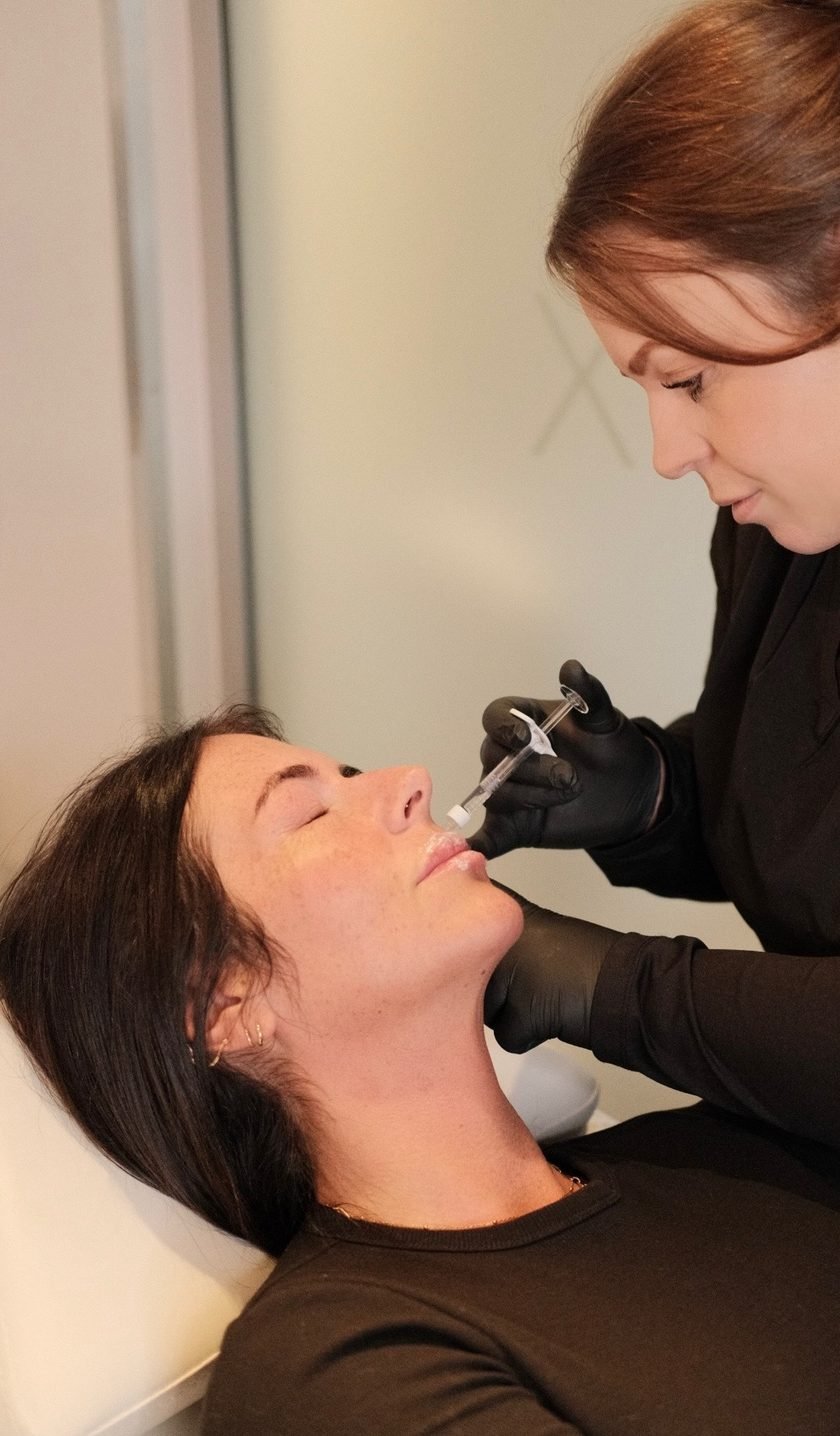 A client during an aesthetic treatment at Skin Aesthetix
